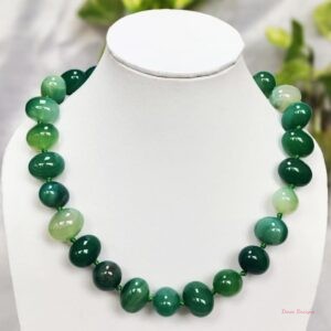 Translucent shades of ovoid-shaped sea green coloured Onyx tumbles come together in this knotted 19” single strand necklace, with a strong spring-ring clasp for durability. DN 0001