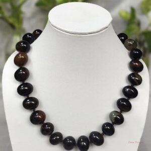 Deep and dark shades of ovoid-shaped chocolate black coloured Onyx tumbles come together in this knotted 19” single strand necklace, with a strong spring-ring clasp for durability DN 0005