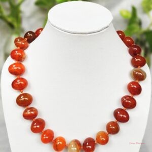 Translucent shades of ovoid-shaped toffee orange and burnt sienna coloured Onyx tumbles come together in this knotted 19” single strand necklace, with a strong spring-ring clasp for durability DN 0006