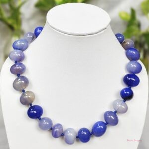 Light and soothing shades of ovoid-shaped sky blue coloured Onyx tumbles come together in this knotted 19” single strand necklace, with a strong spring-ring clasp for durability. DN0014