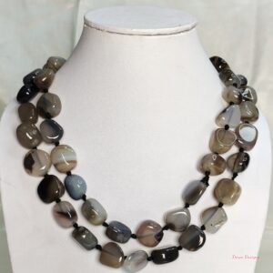 Desert Princess -Delightful irregular tumbles of Onyx in shades of chocolate browns mottled in white and black come together in this knotted 36” single strand necklace. DN0022