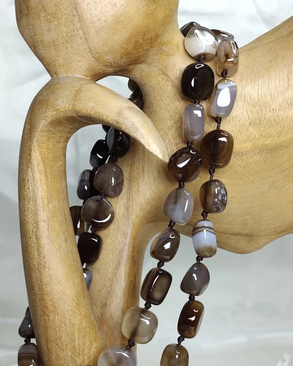 Brown Sugar - Delightful irregular tumbles of Onyx in all the shades of chocolate brown and mottled with white come together in this knotted 36” single strand necklace. DN0026