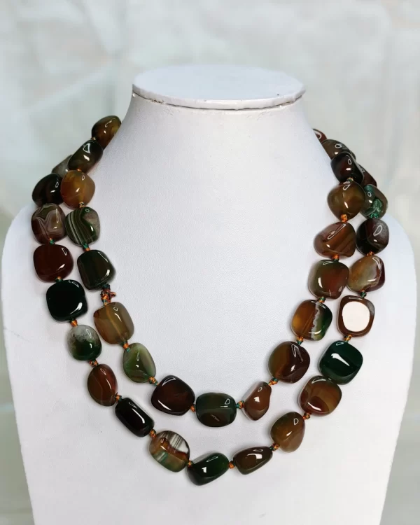 Babbling Brook - Delightful irregular tumbles of Onyx in shades of mossy green and bark brown mottled with flecks of white come together in this knotted 36” single strand necklace. DN0028