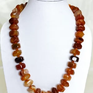 Toffee Trophy - Double cushion cut beads of Onyx in all shades of brown toffee and burnt sienna flecked with varying shades of white come together in this knotted 18” single strand necklace. DN0030