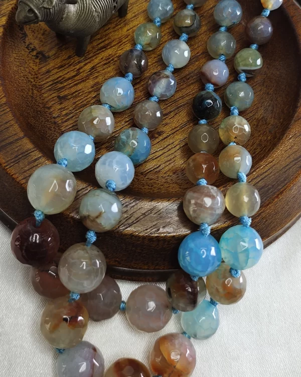 Desert Sky - Knotted 18” double strand of dragon-veined Onyx beads graded in size, in all shades of tropical sky blues and romantic desert browns splotched with whites, orange, and mossy green. DN0038