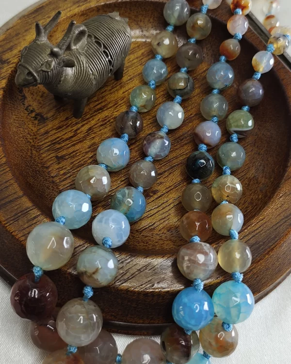 Dusty Diva - Knotted 18” double strand of dragon-veined Onyx beads graded in size, in all shades of tropical sky blues and romantic desert browns splotched with whites, orange, and mossy green. DN0040