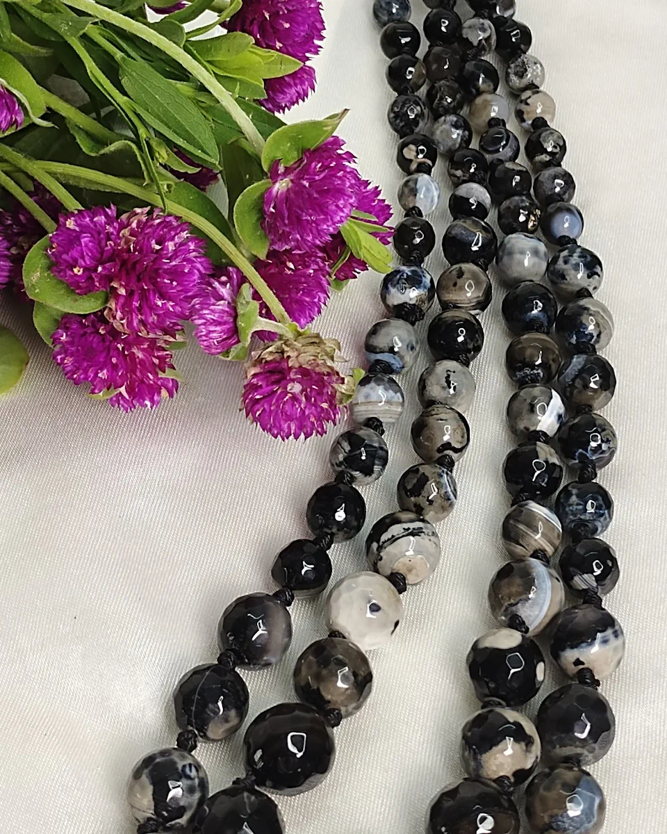 Classic Evenings - Knotted 18” double strand of Onyx beads graded by size, in a palette featuring a mélange of whites, blacks, and grays of all shades – with banding, splotching, and marbling patterns. DN0041