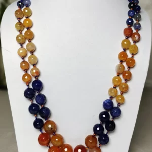 Hippie Chic - Knotted 18” double strand of Onyx beads graded by size, in a palette featuring a mélange of blues and oranges of all shades – with banding, splotching, and marbling patterns. DN0042