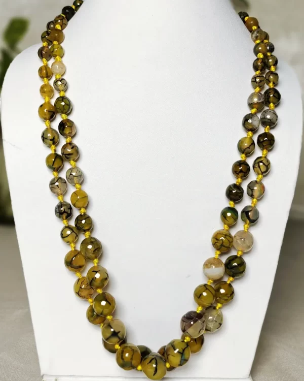 Melon Summer - Knotted 18” double strand of Onyx beads graded by size, in a palette featuring a mélange of melon, silver, and mustard yellows of all shades with banding, splotching, and marbling patterns, and griddled with dragon veins. DN0043