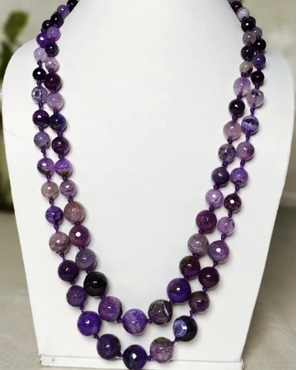 Lavender Love - Knotted 18” double strand of Onyx beads graded by size, in a palette featuring a mélange of lavender, light violets and indigo, and royal purple shades with banding, splotching, and marbling patterns, and griddled with dragon veins. DN0044