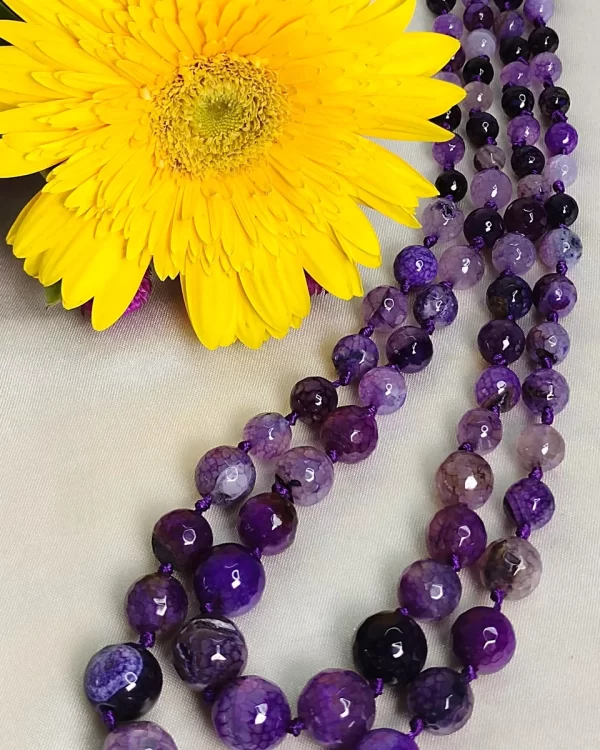 Lavender Love - Knotted 18” double strand of Onyx beads graded by size, in a palette featuring a mélange of lavender, light violets and indigo, and royal purple shades with banding, splotching, and marbling patterns, and griddled with dragon veins. DN0044