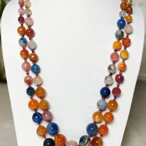 Summer Burst - Knotted 18” double strand of Onyx beads graded by size, in a palette featuring a mélange of oranges, blues, browns, pinks, and off white shades with banding, splotching, and marbling patterns, and griddled with dragon veins. DN0045