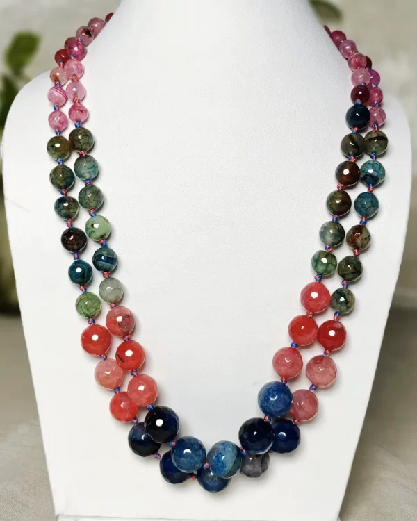 Bubble Gum - Knotted 18” double strand of Onyx beads graded by size, in a palette featuring a mélange of pinks, aqua greens, juicy reds, and sky blue shades with banding, splotching, and marbling patterns, and griddled with dragon veins. DN0048