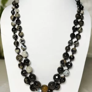 Black Bohemian - Knotted 18” double strand of Onyx beads graded by size, in a palette featuring a mélange of devil black with banding, splotching, and marbling patterns, and griddled with dragon veins. DN0049