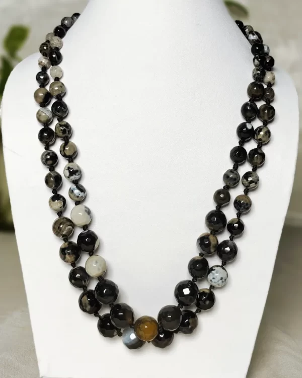 Black Bohemian - Knotted 18” double strand of Onyx beads graded by size, in a palette featuring a mélange of devil black with banding, splotching, and marbling patterns, and griddled with dragon veins. DN0049