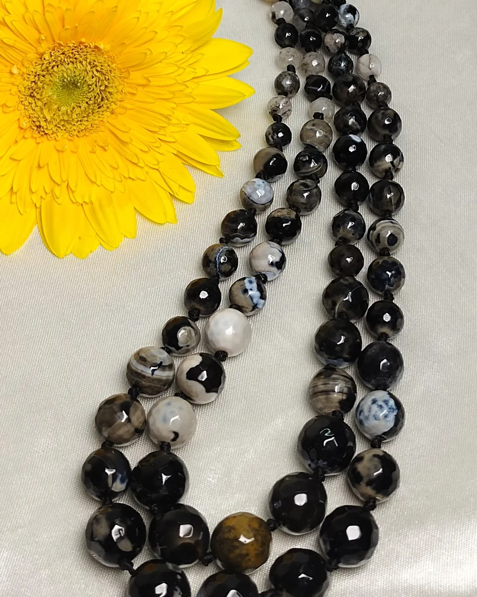 Black Bohemian - Knotted 18” double strand of Onyx beads graded by size, in a palette featuring a mélange of devil black with banding, splotching, and marbling patterns, and griddled with dragon veins. DN0049