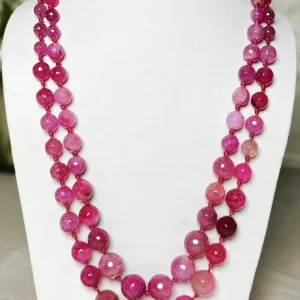 Pink Parade - Knotted 18” double strand of Onyx beads graded by size, in a palette featuring range of pink shades – with banding, splotching, and marbling patterns and griddled with dragon veins. DN0051