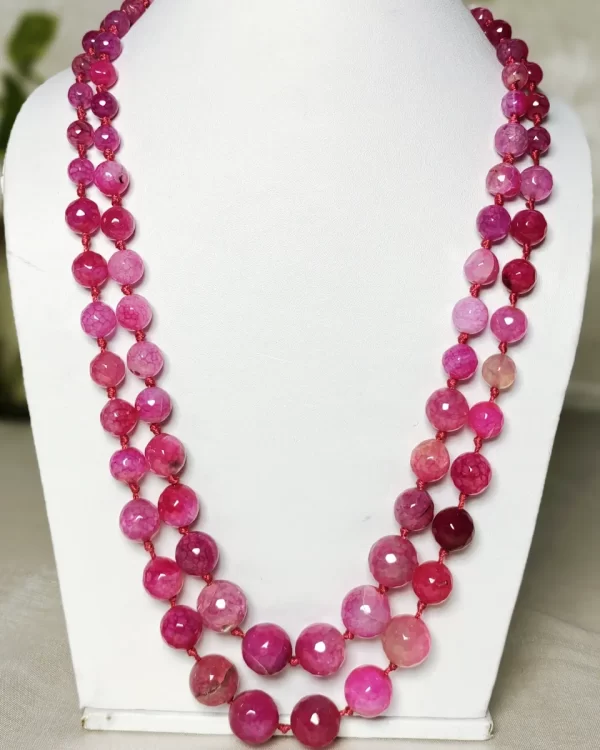 Pink Parade - Knotted 18” double strand of Onyx beads graded by size, in a palette featuring range of pink shades – with banding, splotching, and marbling patterns and griddled with dragon veins. DN0051