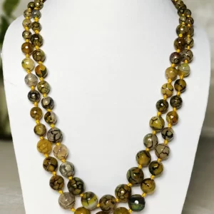 Melon Summer - Knotted 18” double strand of Onyx beads graded by size, in a palette featuring a mélange of melon, silver, and mustard yellows of all shades with banding, splotching, and marbling patterns, and griddled with dragon veins. DN0056