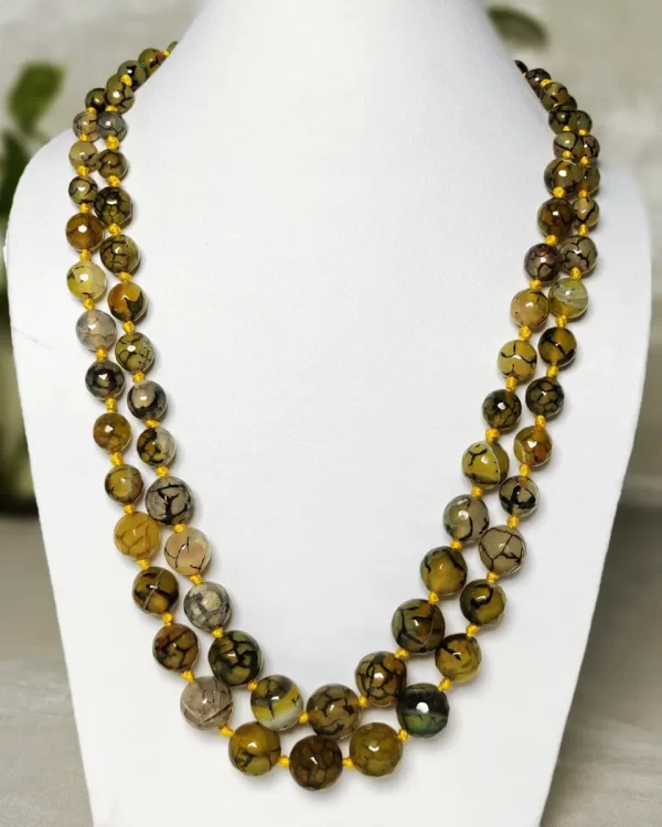 Melon Summer - Knotted 18” double strand of Onyx beads graded by size, in a palette featuring a mélange of melon, silver, and mustard yellows of all shades with banding, splotching, and marbling patterns, and griddled with dragon veins. DN0056