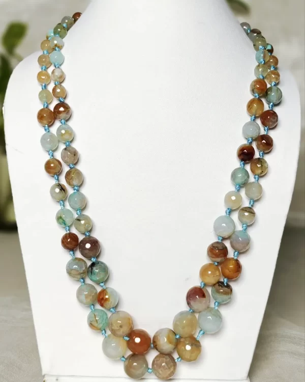 Dusty Diva - Knotted 18” double strand of Onyx beads graded by size, in a palette featuring a mélange of tropical sky blues and romantic desert brown shades with banding, splotching, and marbling patterns, and griddled with dragon veins. DN0057