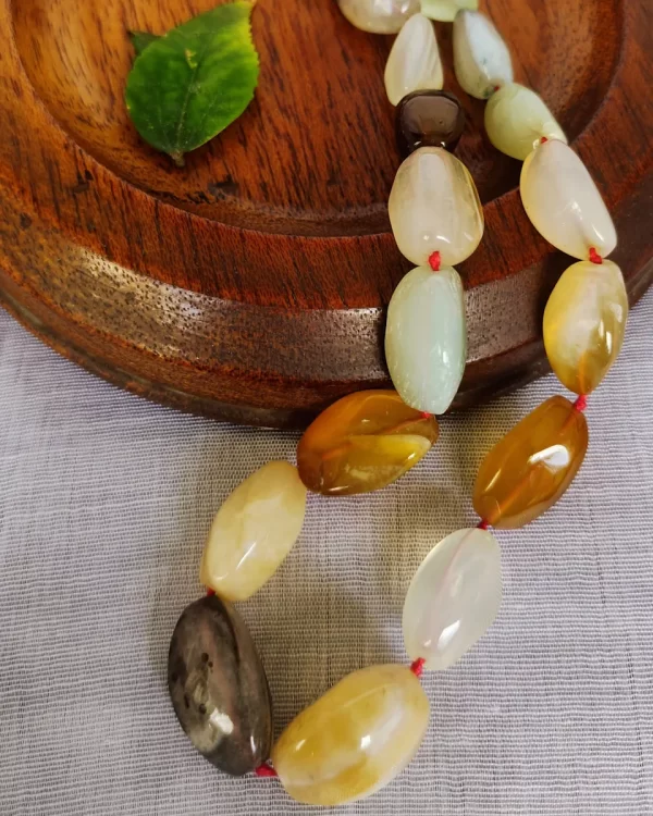 Bijou - DN0120 - Polished tumbles of Agate ranging in colour from off whites to pearly grays, from pale lemon yellow to lazy browns in an 18” necklace.