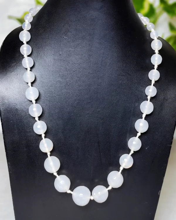 White Spirit - DN0124 - Mottled and splotched off-white small-to-large graded honey-cut Onyx beads in a simple harmonious string of 18"