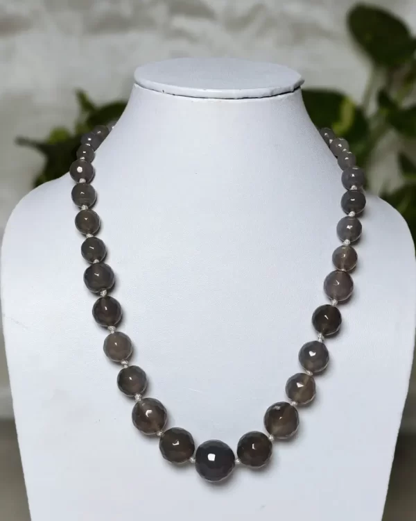 A Touch of Grey - DN0130 - Mottled and splotched light gray small-to-large graded honey-cut Onyx beads in a simple harmonious string of 16"