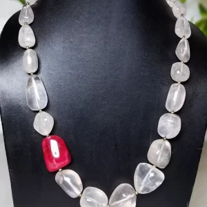 Rose and Rouge - DN0131 - A collection of translucent Rose Quartz tumbles set off an attractive red Iolite tumble in an eye-catching 18" string