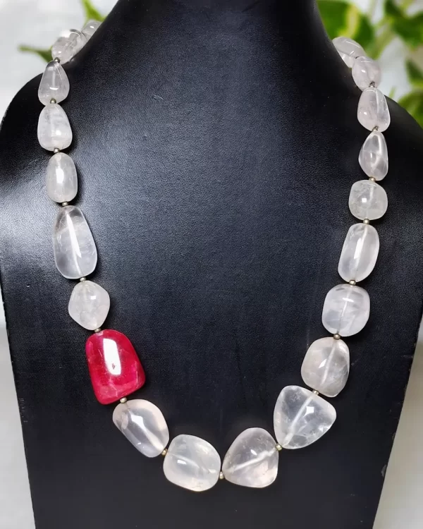 Rose and Rouge - DN0131 - A collection of translucent Rose Quartz tumbles set off an attractive red Iolite tumble in an eye-catching 18" string