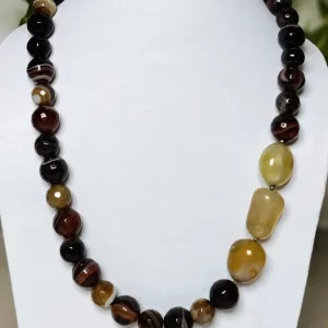 Mithai - DN0138 - A collection of clouded and banded honey-cut beads of Onyx in all shades of brown and honey set off a trio of caramel yellow Quartz tumbles come together in this 20" necklace