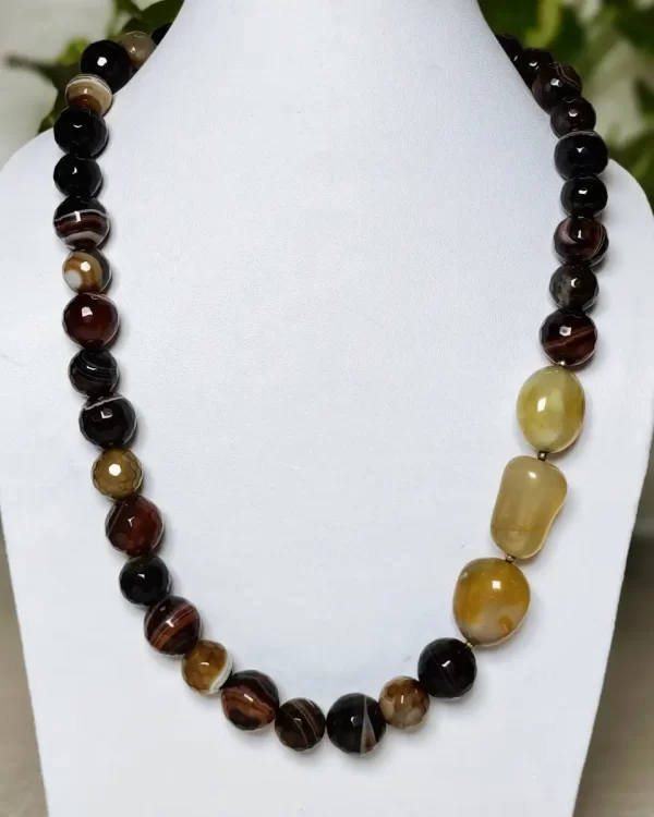 Mithai - DN0138 - A collection of clouded and banded honey-cut beads of Onyx in all shades of brown and honey set off a trio of caramel yellow Quartz tumbles come together in this 20" necklace