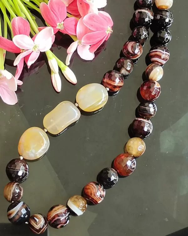 Mithai - DN0138 - A collection of clouded and banded honey-cut beads of Onyx in all shades of brown and honey set off a trio of caramel yellow Quartz tumbles come together in this 20" necklace