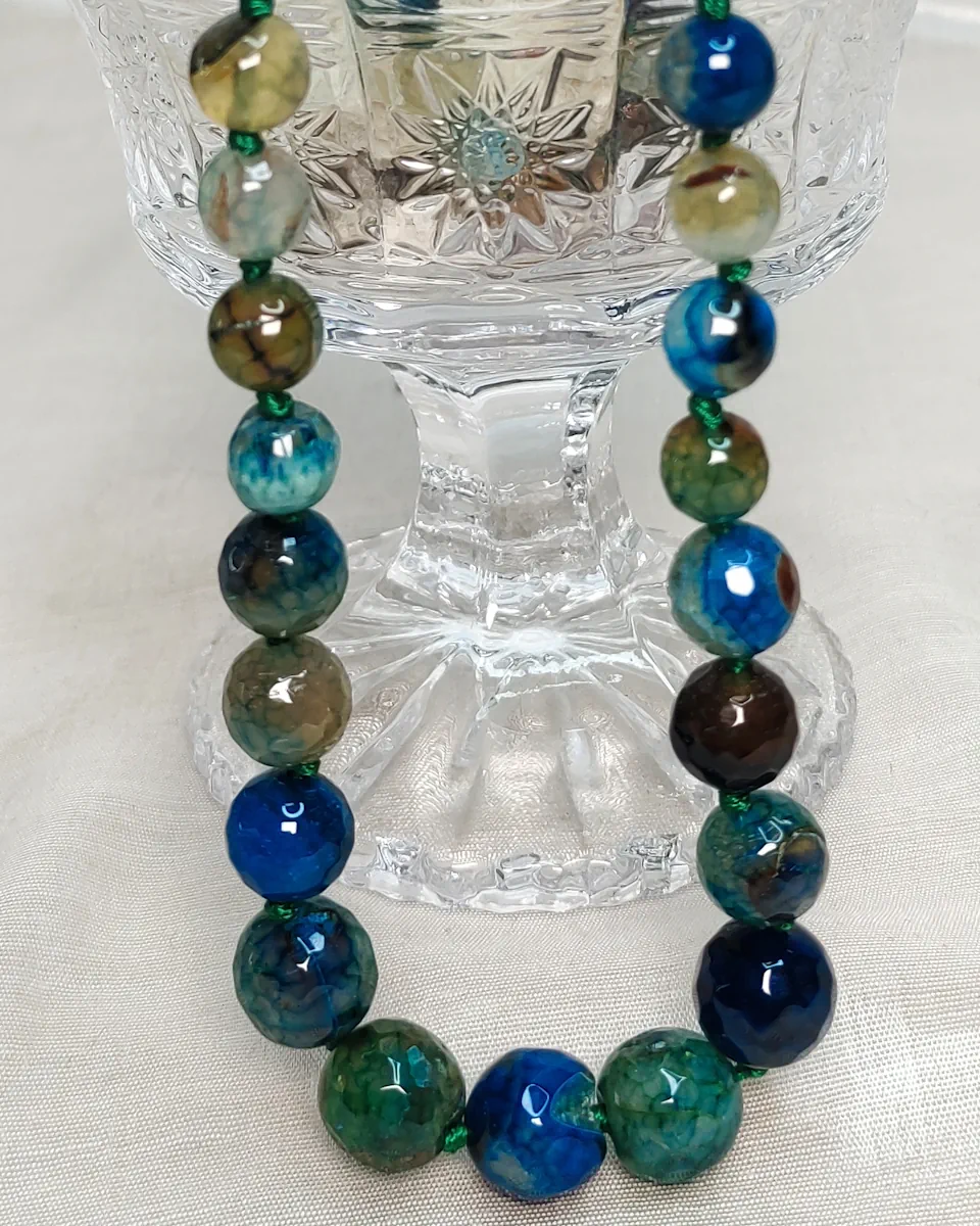 Deep Calm - DN0262 - Knotted 19” single strand of Onyx beads, in a wide palette of grassy greens, blues, mossy browns with banding, splotching, and marbling patterns, and griddled with dragon veins.