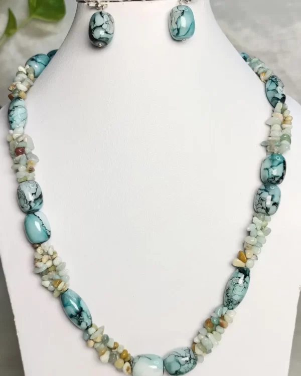 Turquoise Quest - DN0314 - Three lines of rock crystal rice chips in shades of turquoise and white, with Onyx beads with a striking pattern of turquoise banding, splotching, and marbling patterns, griddled with dragon veins come together in this 19” necklace.