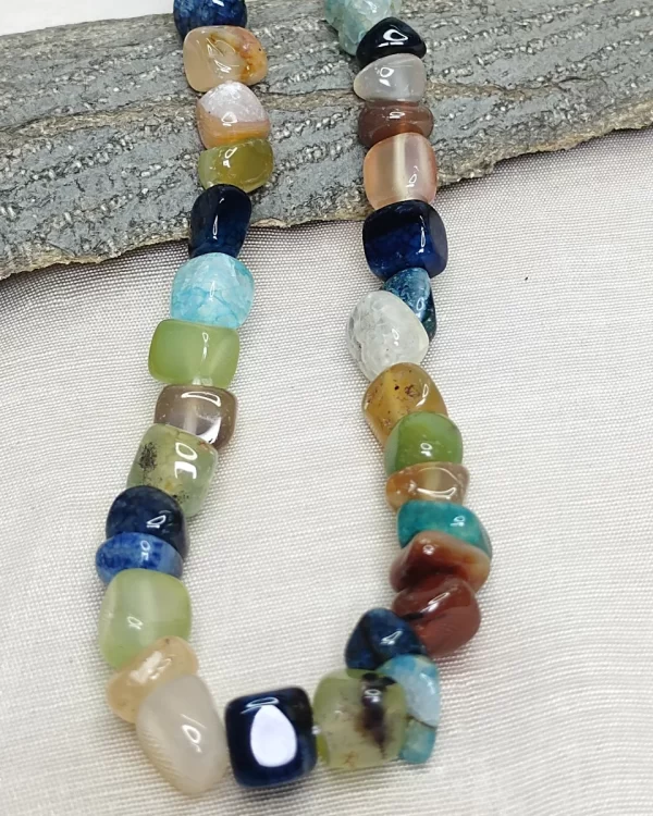 Gypsy Joy - DN0328 - Bright tumbles of agate, onyx, feldspar, iolite, and quartz come together in a freewheeling random design while sending out with a youthful vibe in this 19” necklace.