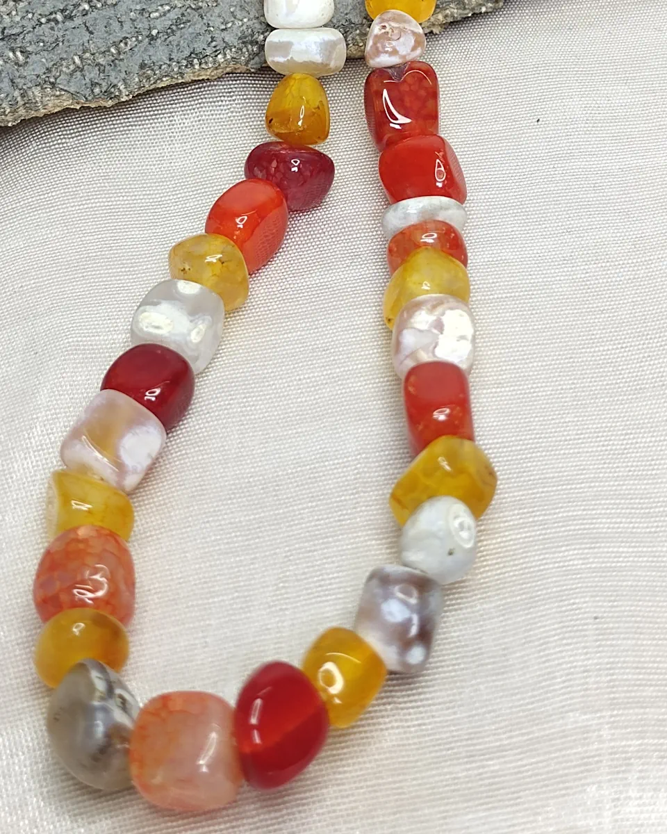 Mango Chutney - DN0358 - Warm, fruity, juicy, and lip-smacking strains of Mama’s mango chutney come together in this 19” necklace of vividly coloured tumbles of agate, onyx, feldspar, iolite, and quartz.