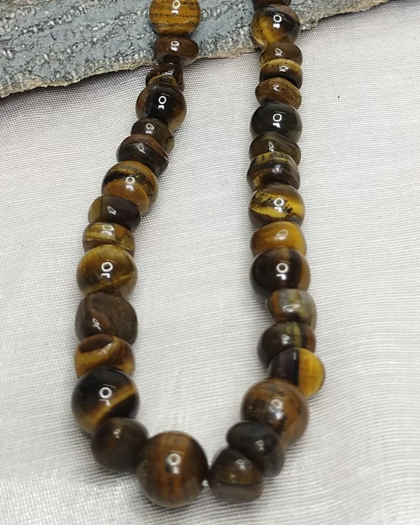 Tiger Trophy - DN0388 - For classics, the less said the better. 19” necklace, tiger’s eye tumbles and beads.