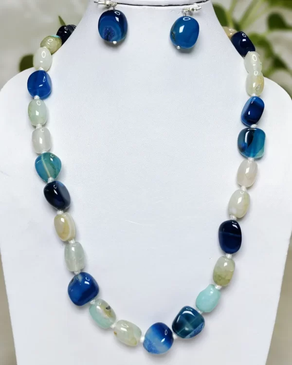 Ice Blue - DN0484 - Dark and light icy blue Onyx tumbles in a 19” creation.