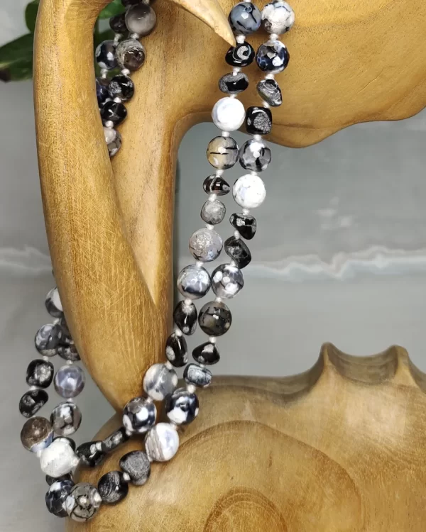 Chiaroscuro - DN0494 - Delicate but boldly splotched white and black Onyx beads in an enticing 40” knotted stunner.