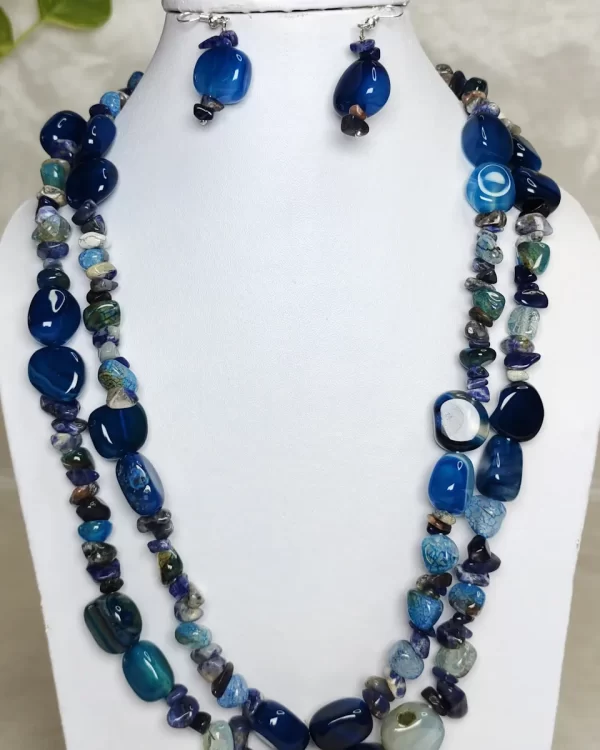 Blue Dynamite - DN0532 - Two simply beautiful 19” strands of tumbles, beads, and chips of slate-blue Onyx form this stunningly beautiful necklace.