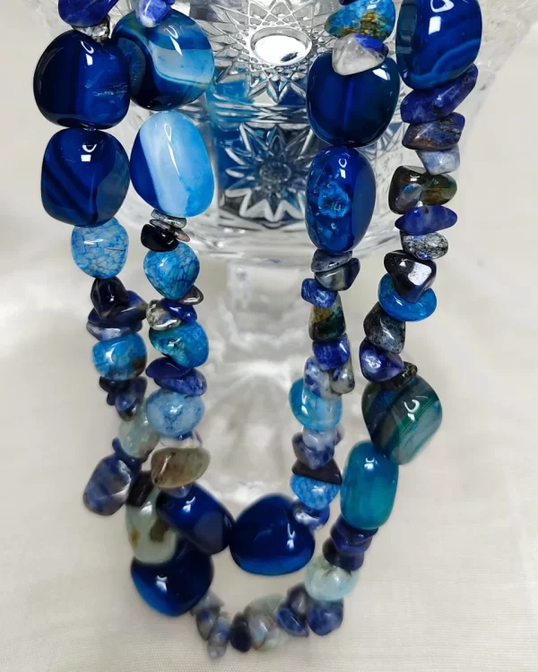 Blue Dynamite - DN0532 - Two simply beautiful 19” strands of tumbles, beads, and chips of slate-blue Onyx form this stunningly beautiful necklace.