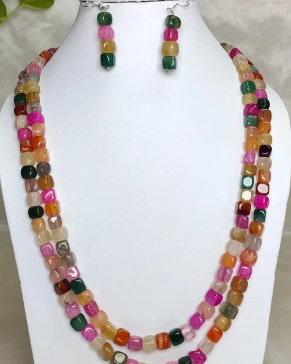 Tropical Quest - DN0547 - Two 19” strands of roughly shaped Onyx cubes come together in a medley of pure eye-popping colour.