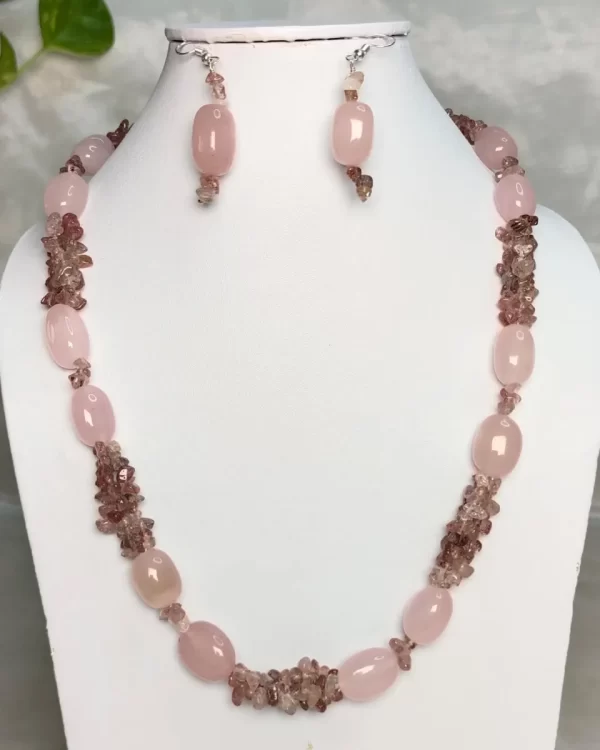 Pink Mist - DN0575 - Three strands of pink tinted Rose Quartz chips pool up with pink Rose Quartz beads to come up with a delightful 19” ring of rose around your neck!